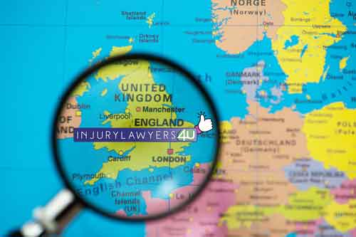 a magnifying glass held over a map of the United Kingdom with the Injury Lawyers 4u logo placed on the map